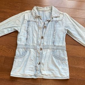 light wash blue denim jacket in a small size with pockets